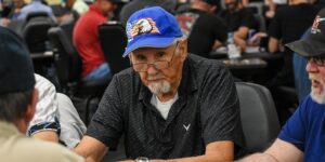 a group of people playing poker at a table
