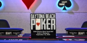 The daytona beach poker tournament trophy is displayed on a table