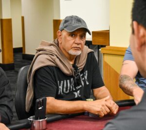 a man sitting at a poker table