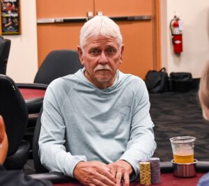 a man sitting at a poker table