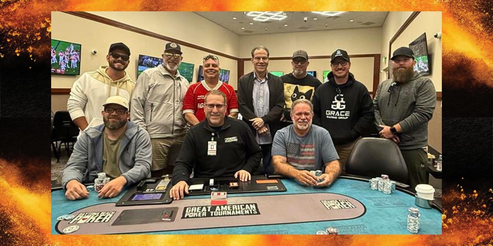 a group of people posing for a photo at a poker table