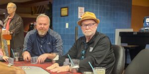 Mack McLaughlin sits at a poker table.