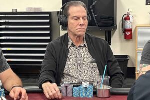 Ignacio Hidalgo plays poker with large headphones.