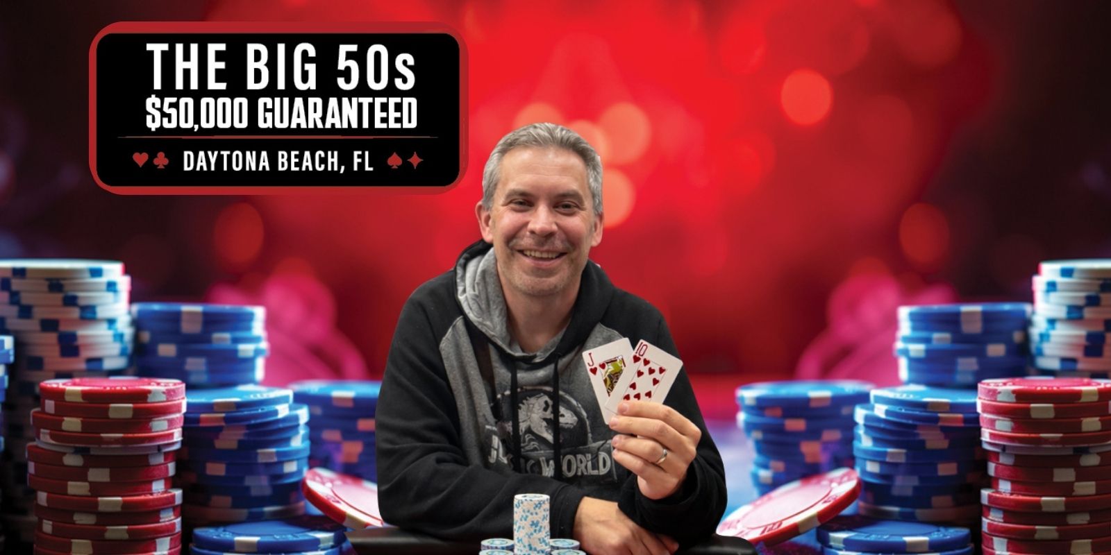 Man holding playing cards at poker room