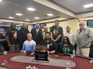 Group of poker players with trophy