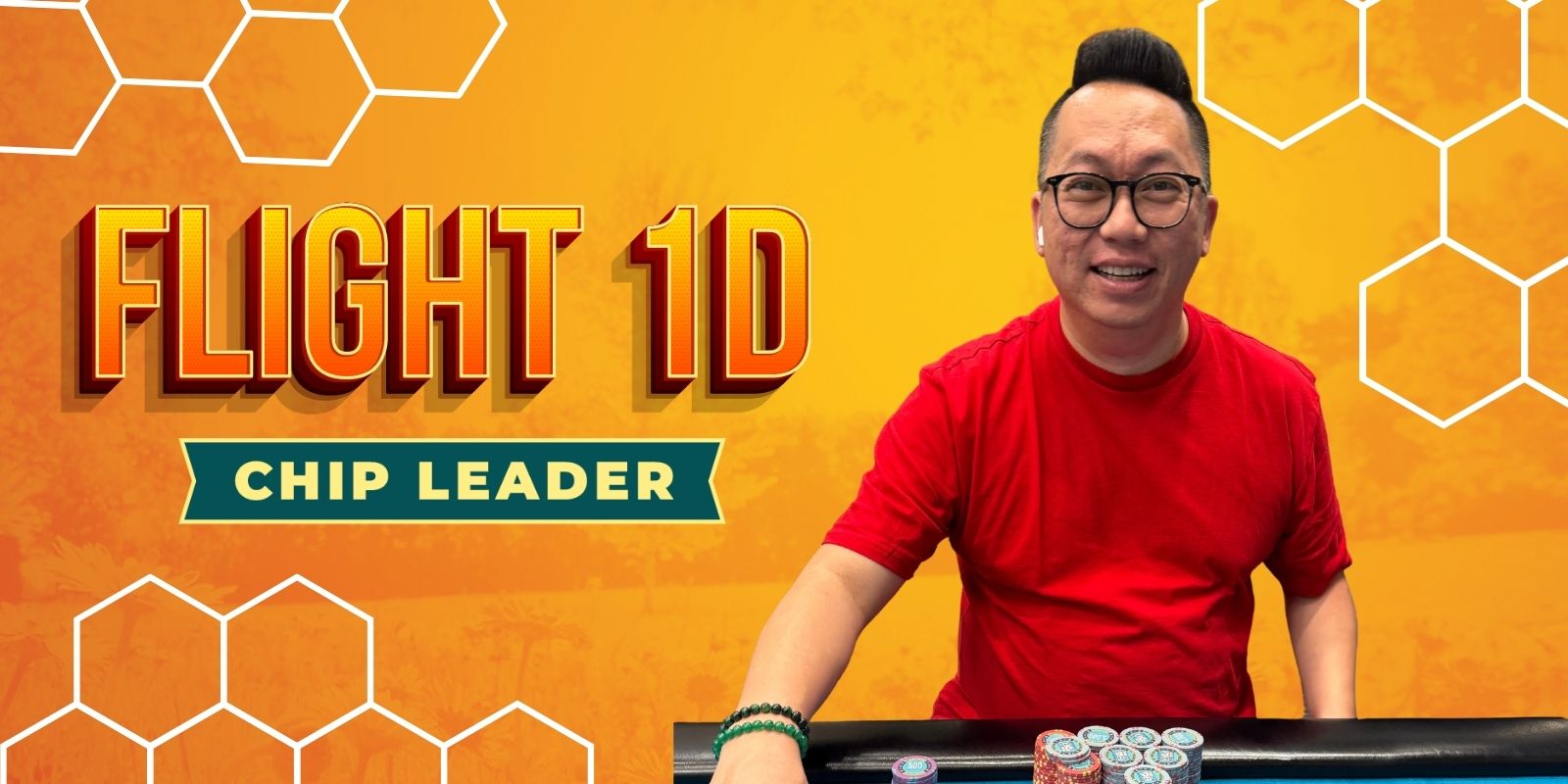 Smiling man, poker chip leader.