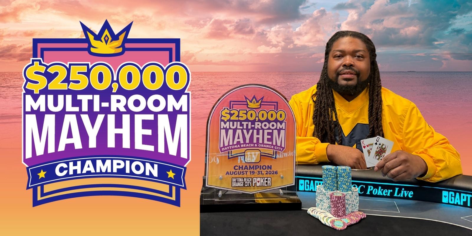 Poker champion with trophy and cards